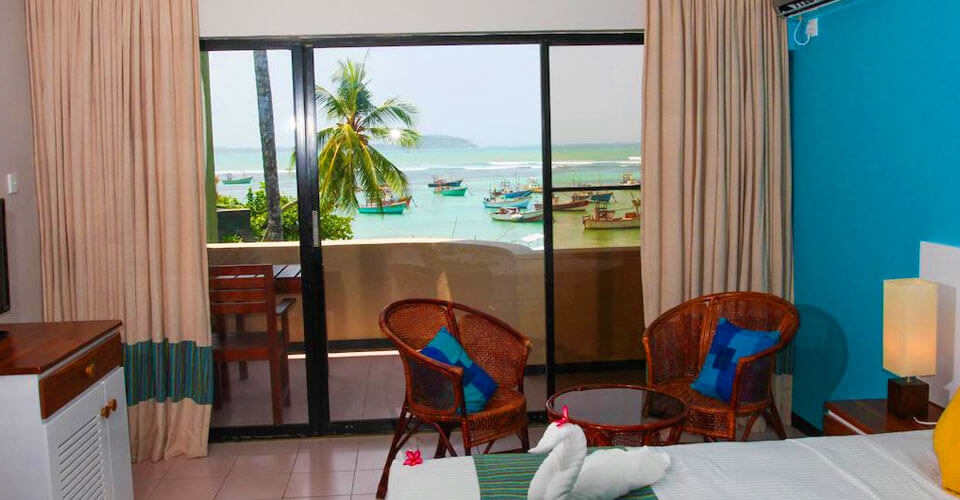 Plush bedding and tasteful décor of the standard rooms