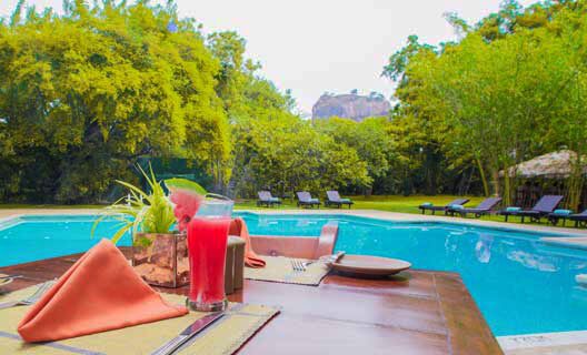 Poolside dining at Sigiriya Village Hotel