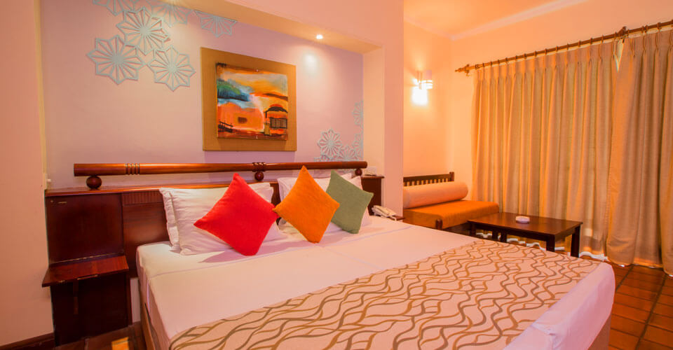 Discover comfort and space at the Deluxe Rooms at The Palms Hotel, Sri Lanka