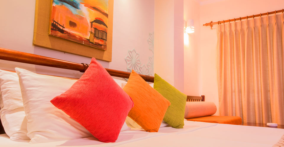 Deluxe Room at The Palms Hotel, Sri Lanka offers extra space and comfortable furnishing